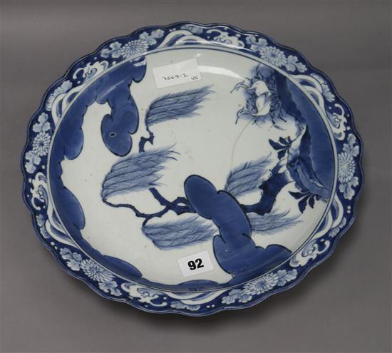 An Arita blue and white dish c.1680/1720, with egrets below a willow tree diameter 35cm